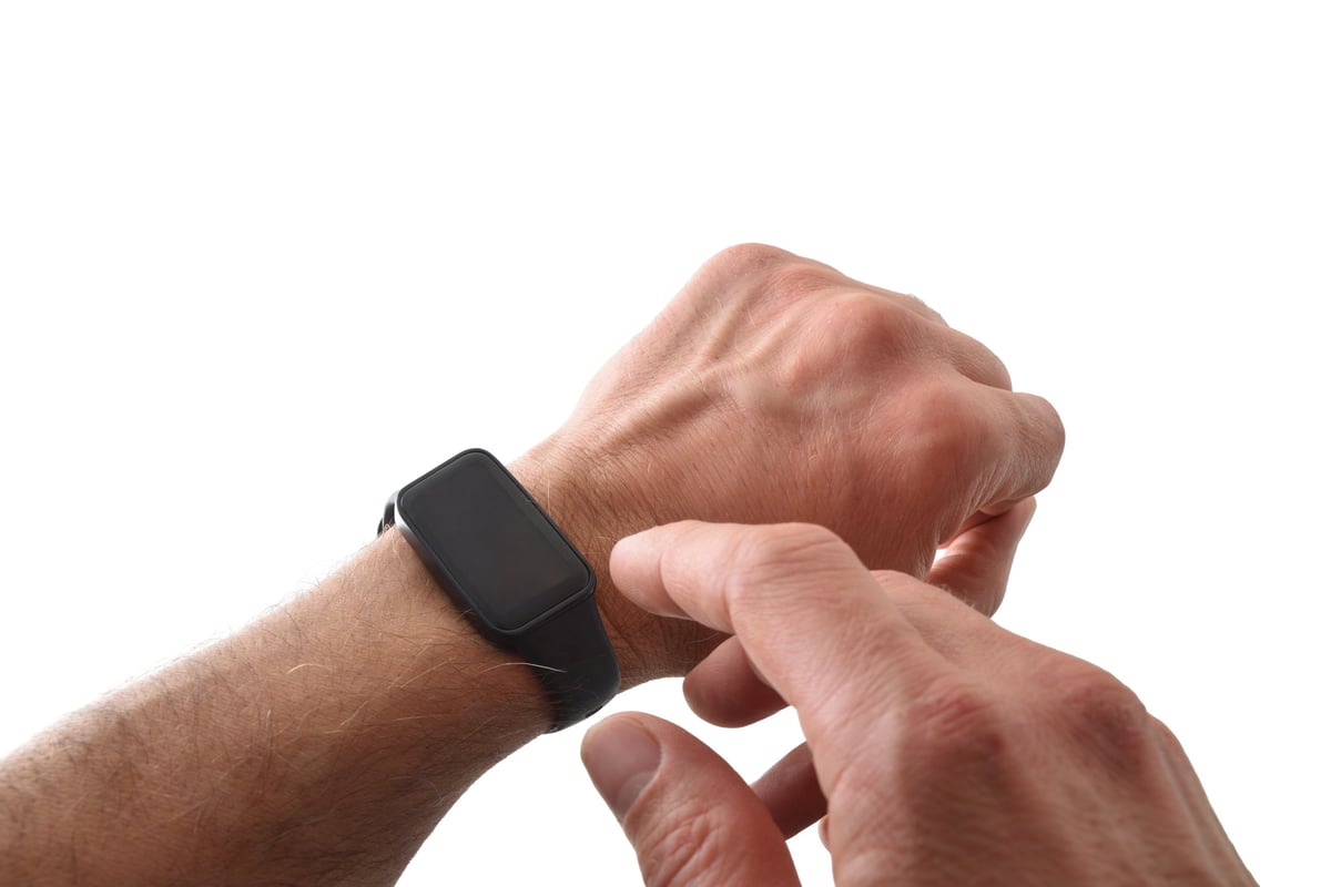Black activity smart watch on wrist