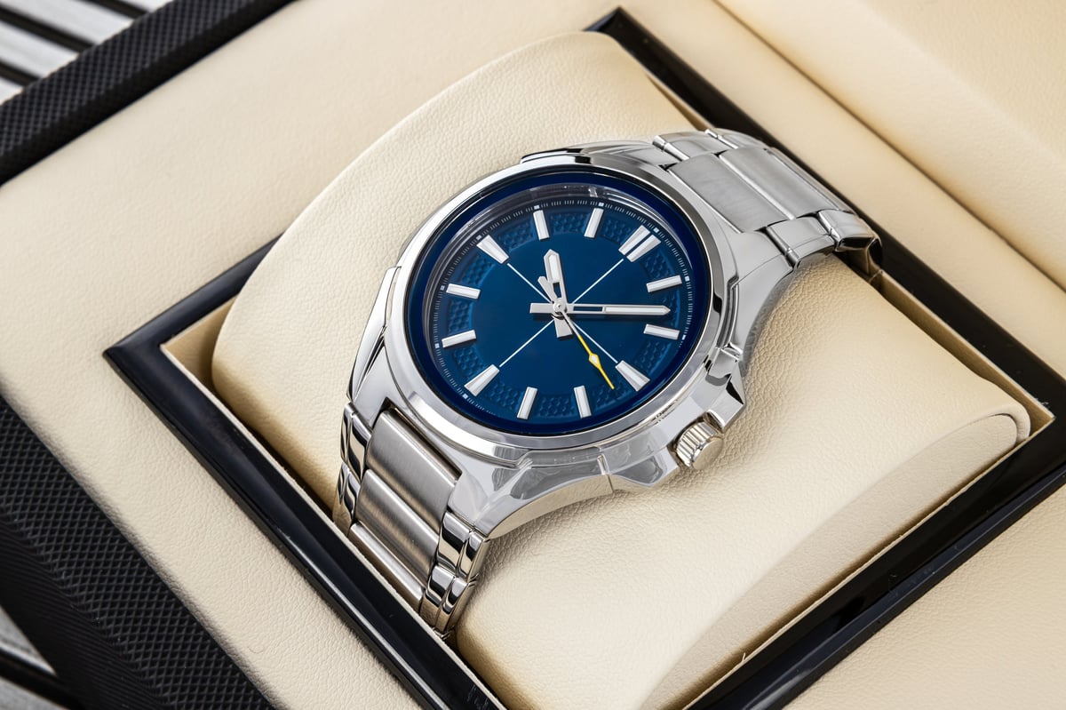 Stylish men's wrist watch with blue face and chronograph in box